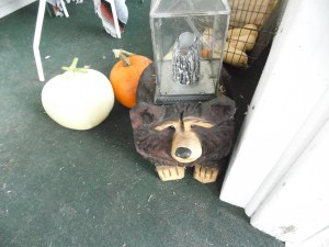 My bear holds a candle to greet folks coming by in the evening.