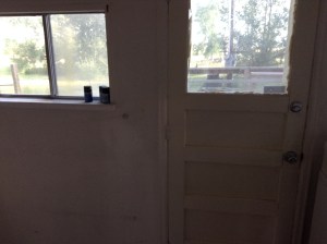 The small laundry/utility room and back door.