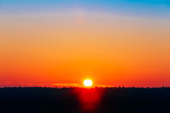 sun-over-horizon-sunset-sunrise-background-50937335